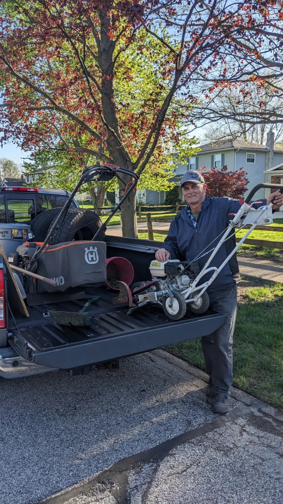 Terry Smith unloading the edger from his work truck